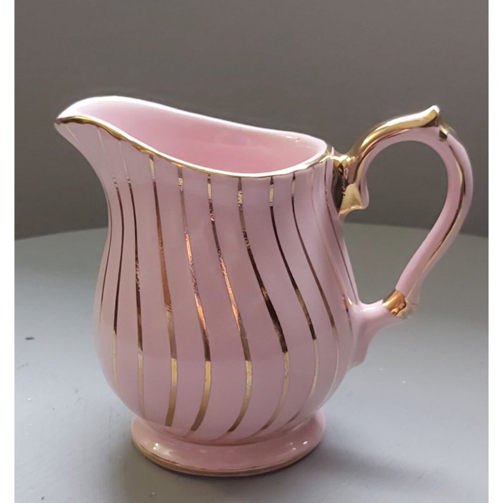 Vintage (1930s) Sadler creamer in pink with gold gilding. Made in England.